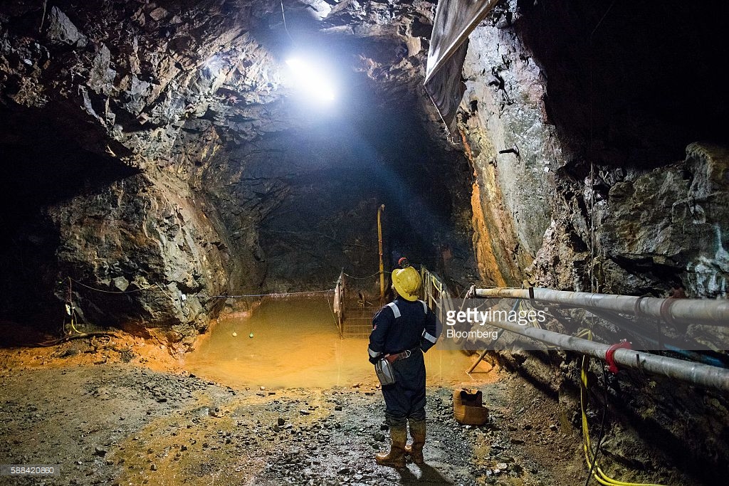 Keith Russ, a technical service engineer of the South Crofty Tin Project, stands in a mining tunnel at South Crofty tin mine in Redruth, U.K., on Thursday, Aug. 11, 2016. Strongbow Exploration Inc., who the bought mine last month, could have the mine in production by 2019 or 2020, delivering 20 tons of tin a day, according to Chief Executive Officer Richard Williams. Photographer: Simon Dawson/Bloomberg